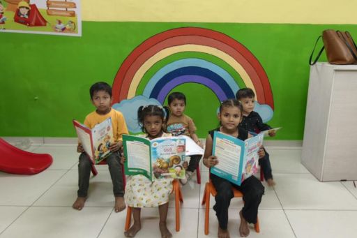 Teacher reading to preschool children